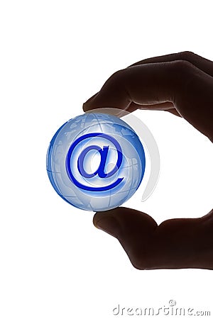 Hand with globe and e-mail symbol Stock Photo