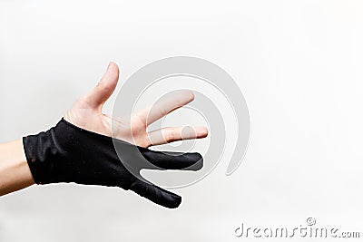 Hand in a glove. Half glove for tablet drawing. Stock Photo