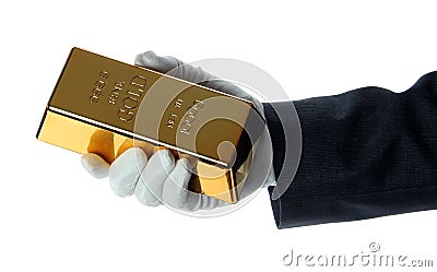 Hand with glove holding a gold bullion Stock Photo