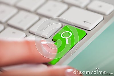 Hand On Green Search Button Stock Photo