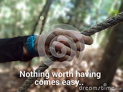 Hand grip the rope and word - NOTHING WORTH HAVING COMES EASY. Stock Photo