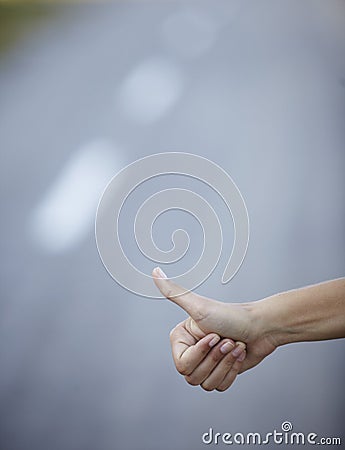 Hand hitchhike on empty road travel adventure Stock Photo