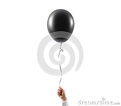 Hand hold blank black balloon mock up isolated. Balloon art. Stock Photo