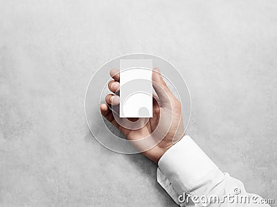 Hand hold blank vertical white business card design mockup. Stock Photo