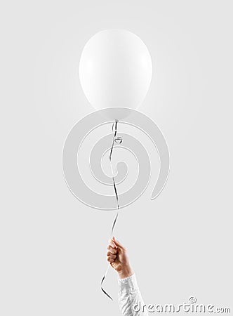 Hand hold blank white balloon mock up . Baloon mockup. Stock Photo