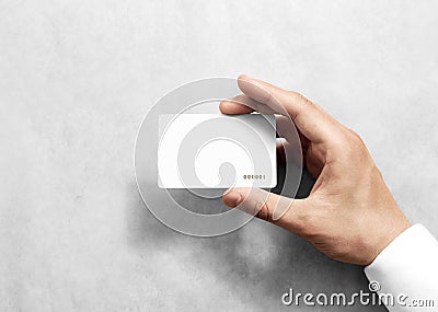 Hand hold blank white loyalty card mockup with rounded corners Stock Photo