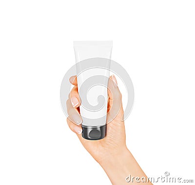 Hand hold blank white tube mock up . Empty cream bottle Stock Photo