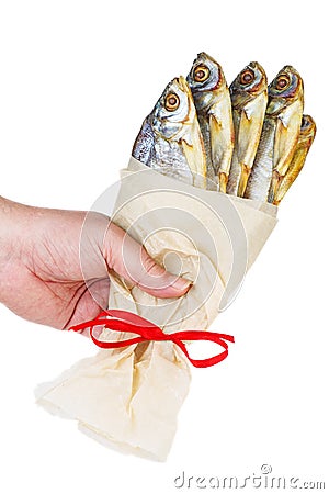 Hand hold bunch of dried white-eye bream Ballerus sapa fish isolated on a white Stock Photo