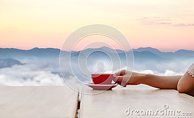 Hand hold coffee cup and coffee of morning sun Stock Photo