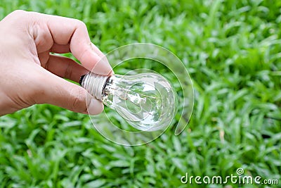 Hand hold incandescent bulb Stock Photo