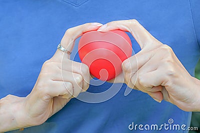 Hand hold red heart, self love, living with happiness in life. mindfulness living Stock Photo