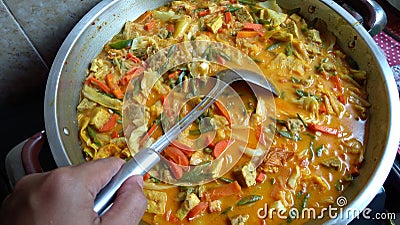 Hand hold sayur Lodeh Vegetable Soup Malaysian Dish Stock Photo