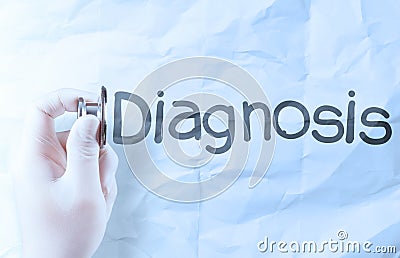 Hand hold stethoscope showing medical concept on crumpled paper Stock Photo