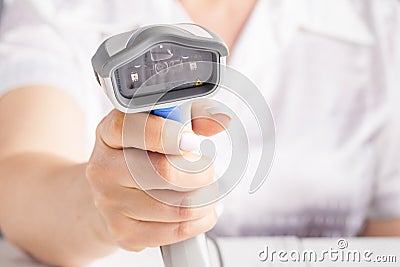 Hand holding barcode scanning. Selective focus Stock Photo