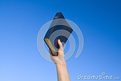 Hand Holding Bible Stock Photo