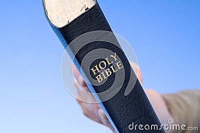 Hand Holding Bible - Close Up Stock Photo