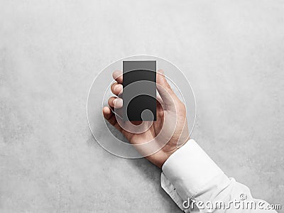 Hand holding blank vertical black business card, design mockup. Stock Photo