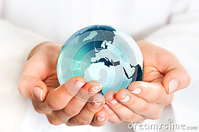 Hand holding blue earth globe Stock Photo