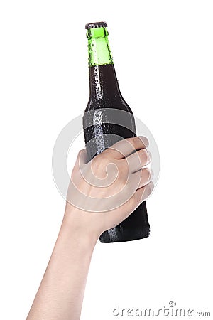 Hand holding Bottle of dark beer Stock Photo