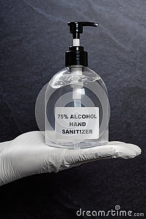 hand holding bottle of 75 percent alcohol instant hand sanitizer Stock Photo