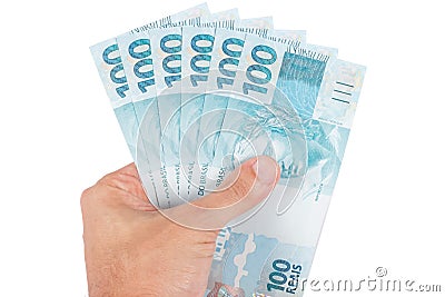 Hand holding brazilian money Stock Photo