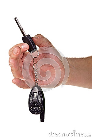 Hand holding car keys and a remote control Stock Photo