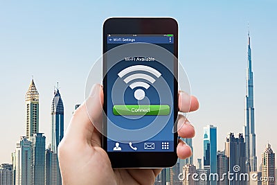 Hand Holding Smart Phone With Wi-fi Availability On Screen Stock Photo