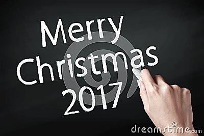 Hand writing merry christmas 2017. Stock Photo
