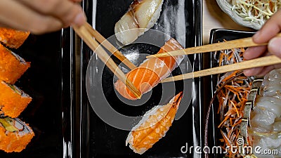 Hand holding chopstick for eat japan food Stock Photo