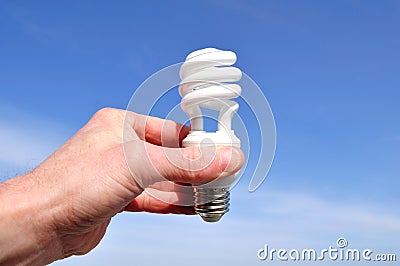 Hand Holding a Compact Fluorescent Light (CFL) Stock Photo