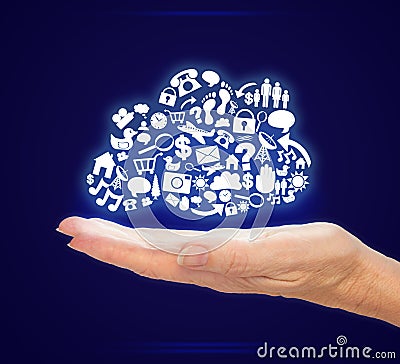 Hand Holding Computer Icons in Cloud Shape on Blue Background Stock Photo