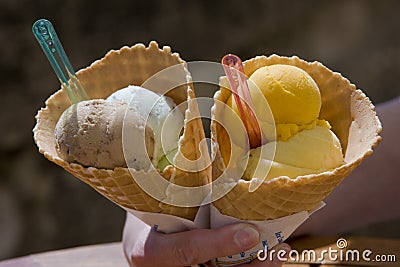 hand holding cones with ice cream Stock Photo