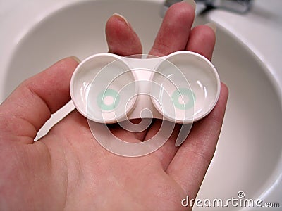 Hand Holding Contact Lens Case Stock Photo