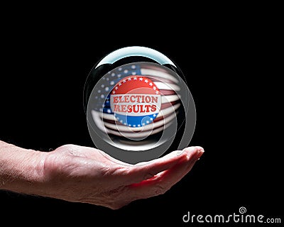 Hand holding a crystal glass forecasting ball to predict the result of the election Stock Photo