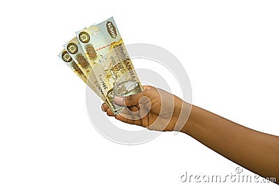 Fair hand holding 3D rendered Zambian Kwacha notes isolated on white background Stock Photo