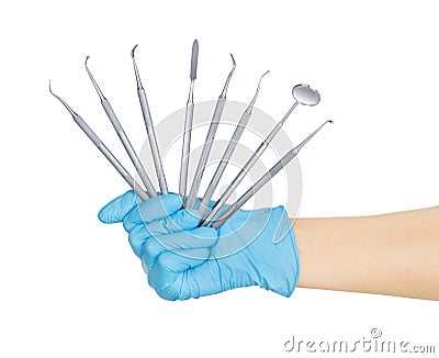 Hand holding dental instruments Stock Photo