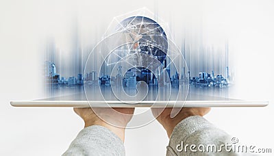 Hand holding digital tablet with global network connection technology and modern buildings hologram. Element of this image are fur Stock Photo