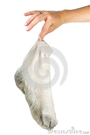 Hand holding dirty white sock Stock Photo