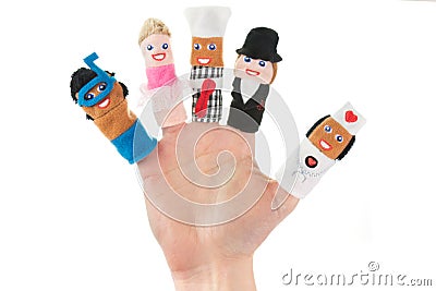 Hand holding five finger puppets Stock Photo