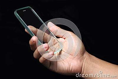 Hand holding futuristic transparent smartphone Stock Photo