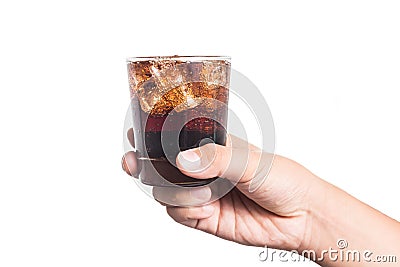 Hand holding a glass of ice filled cold and fizzy cola drink Stock Photo