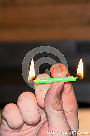 Burning the candle at both ends Stock Photo