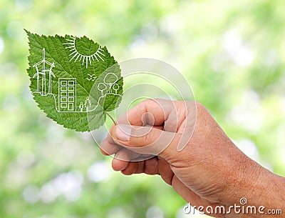 Hand holding Green city concept, cut the leaves of plants Stock Photo