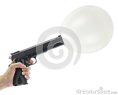 Hand holding gun with balloon Stock Photo