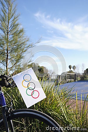 Homemade olympic flag made of paper put on the front of a bicycle Editorial Stock Photo