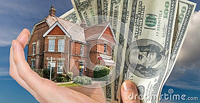 Hand holding house - sale of real estate Stock Photo