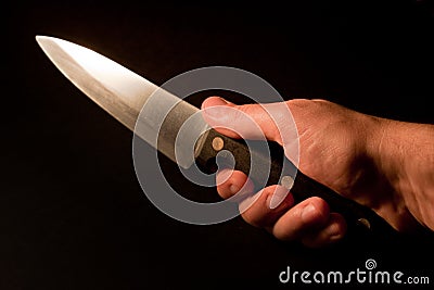 Hand holding knife. Stock Photo