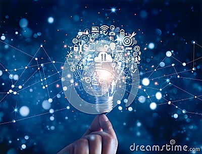 Hand holding light bulb and business digital marketing innovation technology icons on network Stock Photo