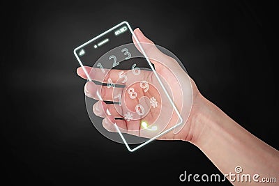 Hand holding light cell phone digital the future on dark background. Stock Photo