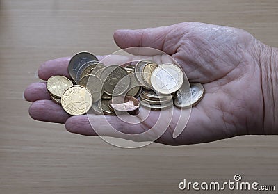 Hand holding lots of euro coins, the currency of the EU Stock Photo